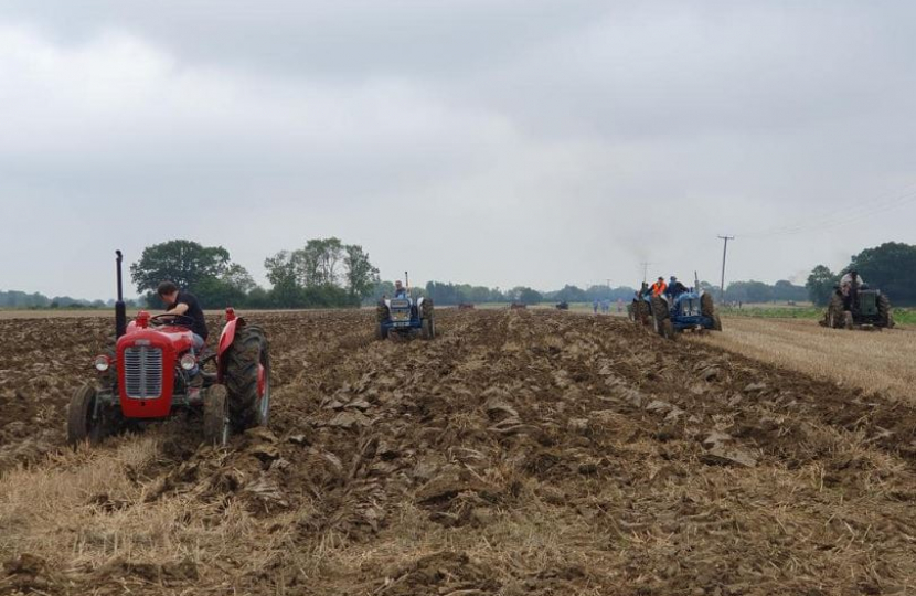 Tractors ploughing a field