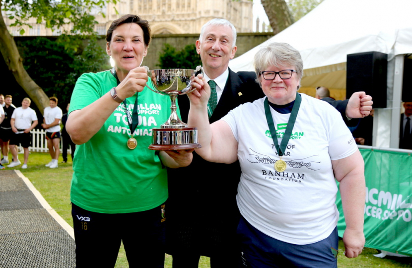 Therese lifting the tug of war trophy