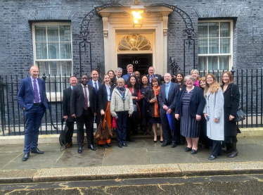 Therese and other attendees outside number 10